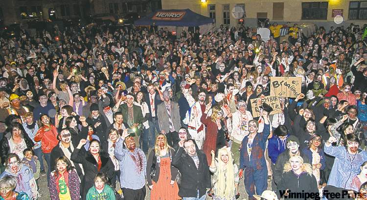 david lipnowski / winnipeg free press
Zombies invade downtown Saturday night during the annual Zombie Walk.