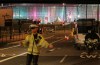 A police officer stands at the scene where the driver of an official Olympic bus carrying journalists has been arrested after a bicyclist was hit and killed, near the Olympic Park in Stratford, London, Wednesday, Aug. 1, 2012. (AP Photo/Yui Mok, PA) UNITED KINGDOM OUT NO SALES NO ARCHIVE