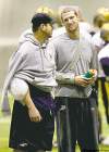 WAYNE.GLOWACKI@FREEPRESS.MB.CA   
Injured Bomber QBs Buck Pierce (left) and Alex Brink have a chat on the sidelines Tuesday.