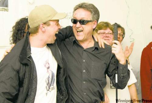 DAVID LIPNOWSKI / WINNIPEG FREE PRESS 
Ross Eadie (right) celebrates winning with campaign manager Aaron McDowell.