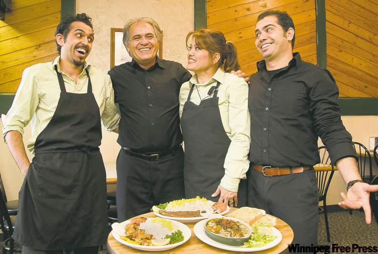 DAVID LIPNOWSKI / WINNIPEG FREE PRESS
From left, Saman Jafari, Morteza Jafari, Farahnuz Mehran and Siamak Jafri at the family operated Darakeh Restaurant in St. Adolphe.