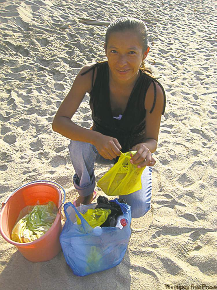 Postmedia
The daughter of the Tamale maker sells the author’s family her freshly prepared veggie and chicken tamales every afternoon.