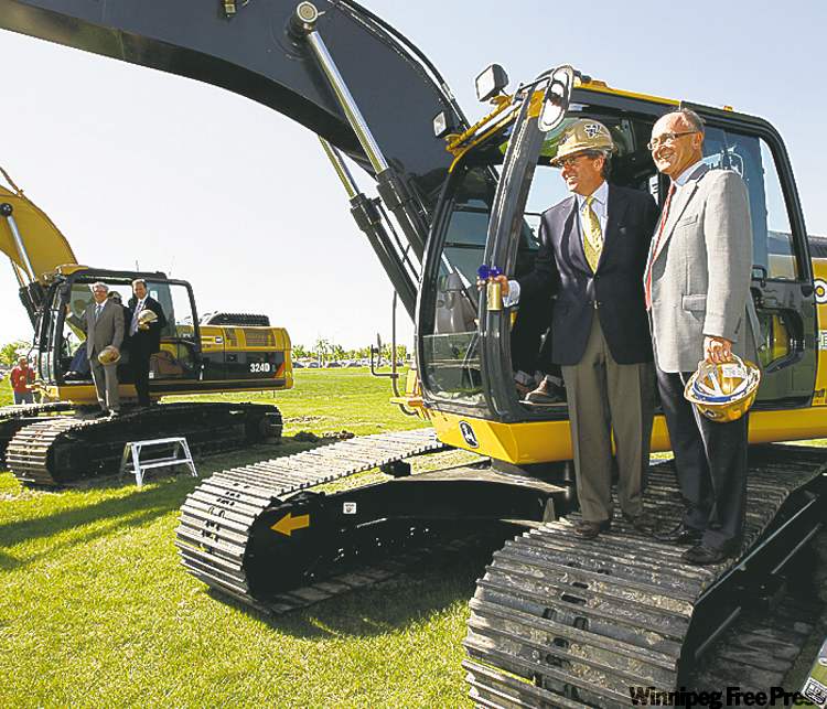 KEN GIGLIOTTI / WINNIPEG FREE PRESS ARCHIVES
Developer David Asper (left) and Blue Bombers chairman Bill Watchorn take part in sod-turning for new stadium in May.