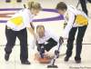 JOE.BRYKSA@FREEPRESS.MB.CA
Manitoba second Allan Lawn delivers a stone as brushers Lisa Blixhavn (left) and Lana Hunter (right) keep the line clean Sunday in Morris.
