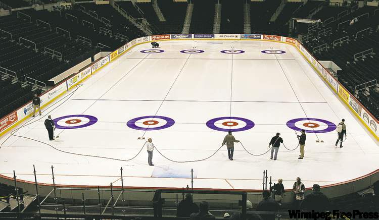 KEN GIGLIOTTI / WINNIPEG FREE PRESS ARCHIVES
The MTS centre's Kevin Donnelly helps bring the Brier to Winnipeg in 2008 and the icemakers could be setting up the rings again for the Olympic Trials in 2013.