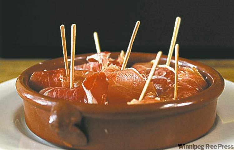 Melon wrapped with Serrano ham