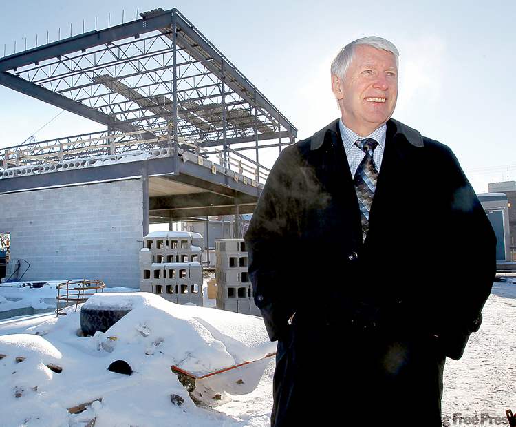 WAYNE GLOWACKI / WINNIPEG FREE PRESS ARCHIVES
John Courtney of Youth For Christ stands at the site of its youth centre, under construction on Main Street.