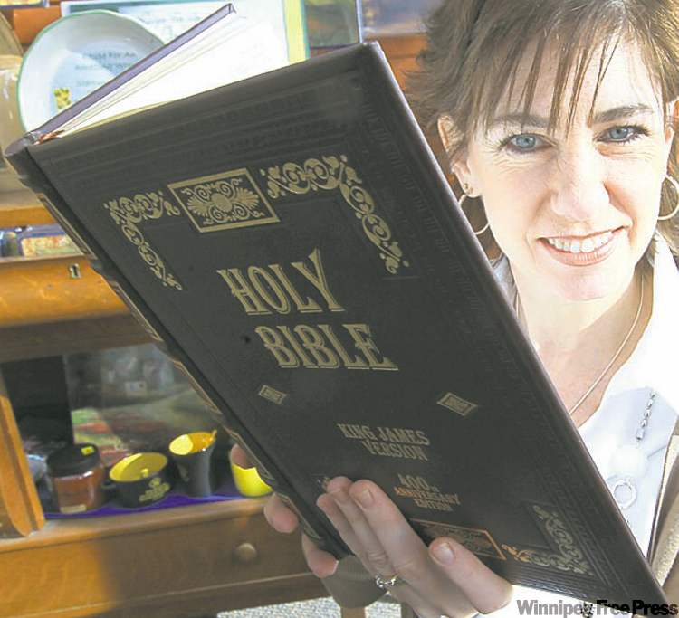 joe.bryksa@freepress.mb.ca
Margo Smith holds a reproduction of an original King James Version Bible, which came out 400 years ago.