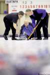 john woods / winnipeg free press
Keith Fenton (left) and Scott Grant sweep Kerry Burtnyk's rock during play at the Heather Curling Club Thursday.