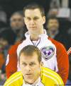 MARK BLINCH / REUTERS
Manitoba skip Jeff Stoughton lines up a shot in front of Newfoundland’s Brad Gushue during their Page playoff 1 vs. 2 game at the Brier Friday night.
