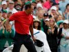 Tiger Woods reacts as he wins the Masters golf tournament Sunday, April 14, 2019, in Augusta, Ga. Golf Town Canada's website nearly crashed Sunday from the volume of people trying to buy the red Nike mock turtleneck shirt Woods wore when he captured his fifth Masters title. THE CANADIAN PRESS/AP/Marcio Jose Sanchez