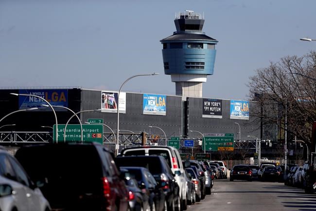 The air traffic control tower at LaGuardia Airport is seen, Friday, Jan. 25, 2019, in New York. The Federal Aviation Administration reported delays in air travel Friday because of a