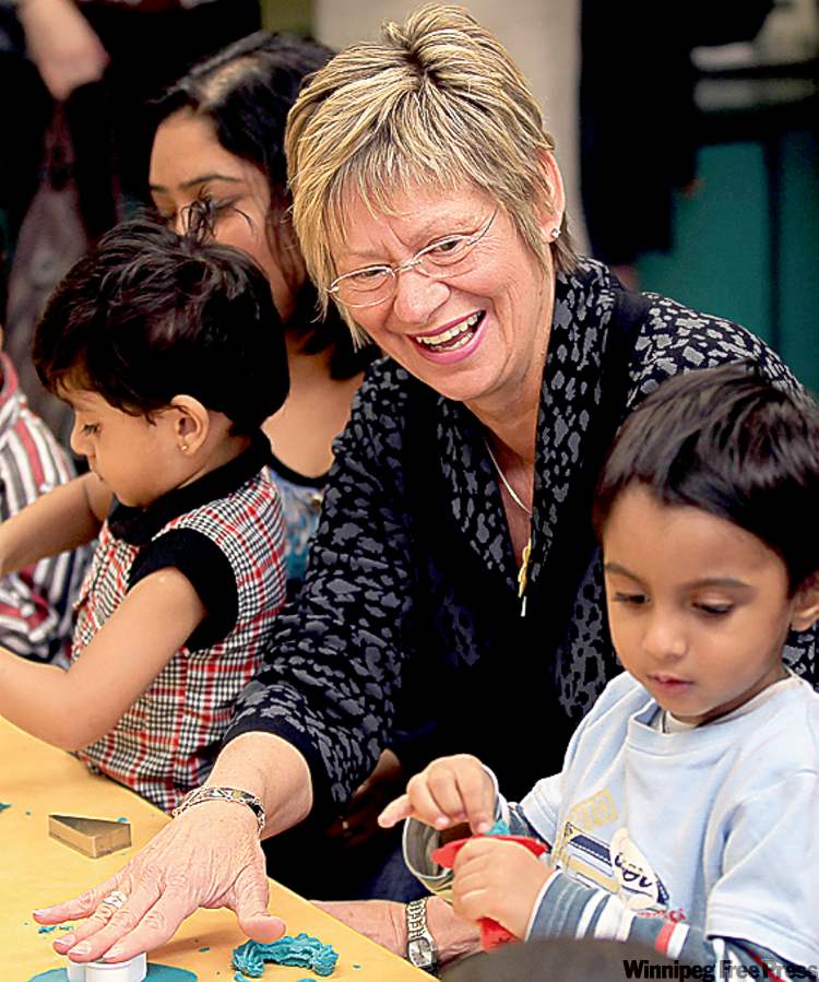 JOE.BRYKSA@FREEPRESS.MB.CA
Education Minister Nancy Allan with children at Victor Mager School Wednesday.