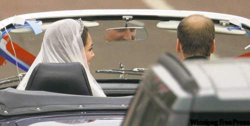 MATT DUNHAM / THE ASSOCIATED PRESS
The royal newlyweds drive away from a reception at Buckingham Palace in an Aston Martin Volante festooned with ribbons, bows and balloons and a licence plate that read ‘JU5T WED.’