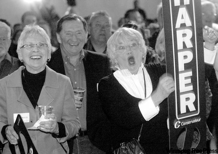 Ted Rhodes / Postmedia News
Conservative supporters Eleanor Art (left) and Diane Leinweber cheer as the results roll in at the Telus Convention Centre in Calgary Monday night.