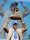 Jacques Boissinot / the canadian press archives
St. Francis Xavier linebacker Henoc Muamba hoists the President's Trophy as the nation's top defensive player.