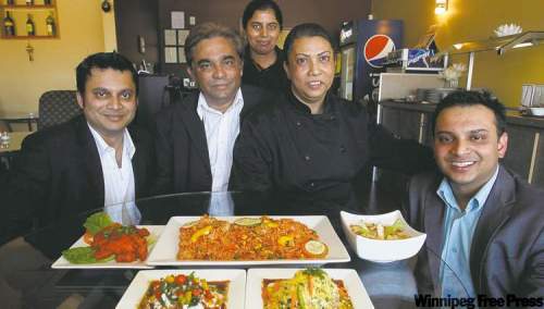BORIS.MINKEVICH@FREEPRESS.MB.CA
From left, Pinky Singh, Narmin Biswas, Rashid Islam, Rana Biswas and Antu Biswas at Water Lily East Indian Restaurant.