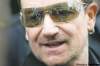 David Lipnowski / Winnipeg Free Press (May 27, 2011)
U2 fans are reflected in Bono's signature sunglasses as he greets fans at the back entrance of the Burton Cummings Theatre Friday afternoon.