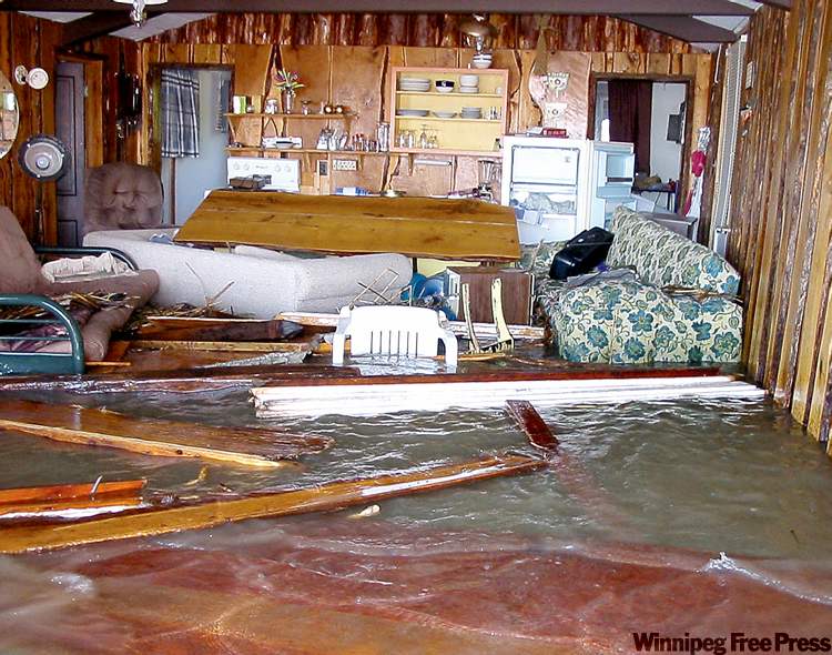 PHOTOS BY BILL REDEKOP / WINNIPEG FREE PRESS
Waves picked up the deck and smashed it through the front living room of this cottage on Dauphin Lake.