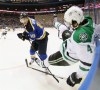 St. Louis Blues right wing Scottie Upshall, left, checks Dallas Stars defenseman Jason Demers into the boards in the first period of Game 3 of the NHL hockey Stanley Cup Western Conference semifinals against the Dallas Stars, Tuesday, May 3, 2016, in St. Louis. (Chris Lee/St. Louis Post-Dispatch via AP) EDWARDSVILLE INTELLIGENCER OUT; THE ALTON TELEGRAPH OUT; MANDATORY CREDIT