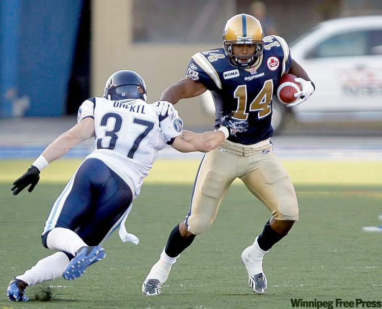 CP
Trevor Hagan / THE CANADIAN PRESS
Toronto�s Jeremy Unertl tries to stop Blue Bomber Terence Jeffers-Harris.