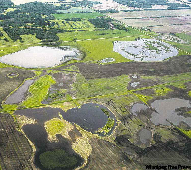 MIKE DEAL / WINNIPEG FREE PRESS ARCHIVES
A look at water-logged southwest Manitoba last month. Aid packages includes $30 per acre for unseeded and flooded-out areas.