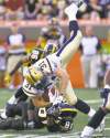 darren calabrese / the canadian press
Blue Bombers safety Ian Logan is upended by Hamilton's Aaron Kelly after making a second-half interception.