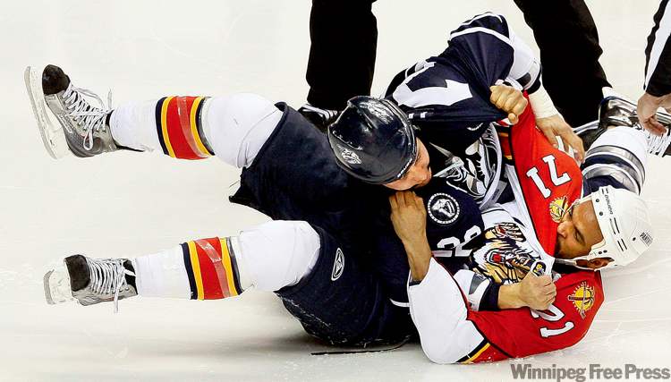 CP
Kenndal McArdle (71, while with Florida) gets down with Jordin Tootoo of the Nashville Predators. McArdle made $800,000 in the NHL on a two-way deal last year.