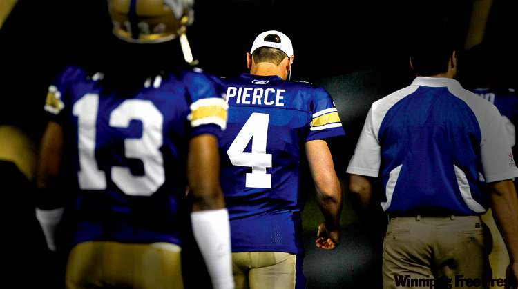 RUTH BONNEVILLE / WINNIPEG FREE PRESS
Buck Pierce walks off the field to the locker-room after the loss to the Calgary Stampeders Thursday night. He had to sit out the second half due to a quadriceps bruise he got in the first half.