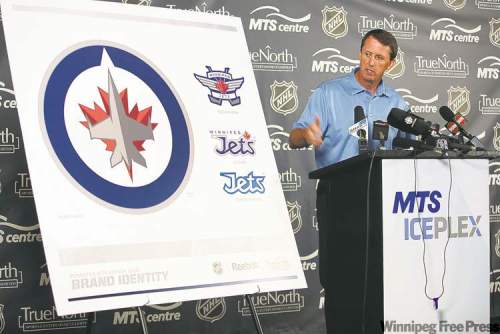 John Woods/Winnipeg Free Press
JOHN WOODS / WINNIPEG FREE PRESS
Jets governor Mark Chipman shows off his team�s new logos Friday. He says the main symbol reflects Winnipeg�s close connection to the nation�s air force.
