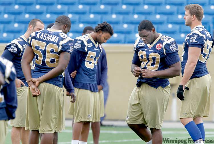 Wayne Glowacki/ Winnipeg Free Press
It’s almost as if the Bombers didn’t know what to do during a subdued practice Wednesday at Canad Inns Stadium, a day after their coach Richard Harris suddenly died.