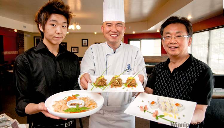 HADAS PARUSH / WINNIPEG FREE PRESS
From left, waiter Jimmy Chung, chef Ki Young So and owner Ted Chung serve up Korean pancake, Japanese Chai noodles and sushi, respectively, at Seoul Buffet.
From left, waiter Jimmy Chung, chef Ki Young So and owner Ted Chung serve up Korean pancake, Japanese Chai noodles and sushi, respectively, at Seoul Buffet.