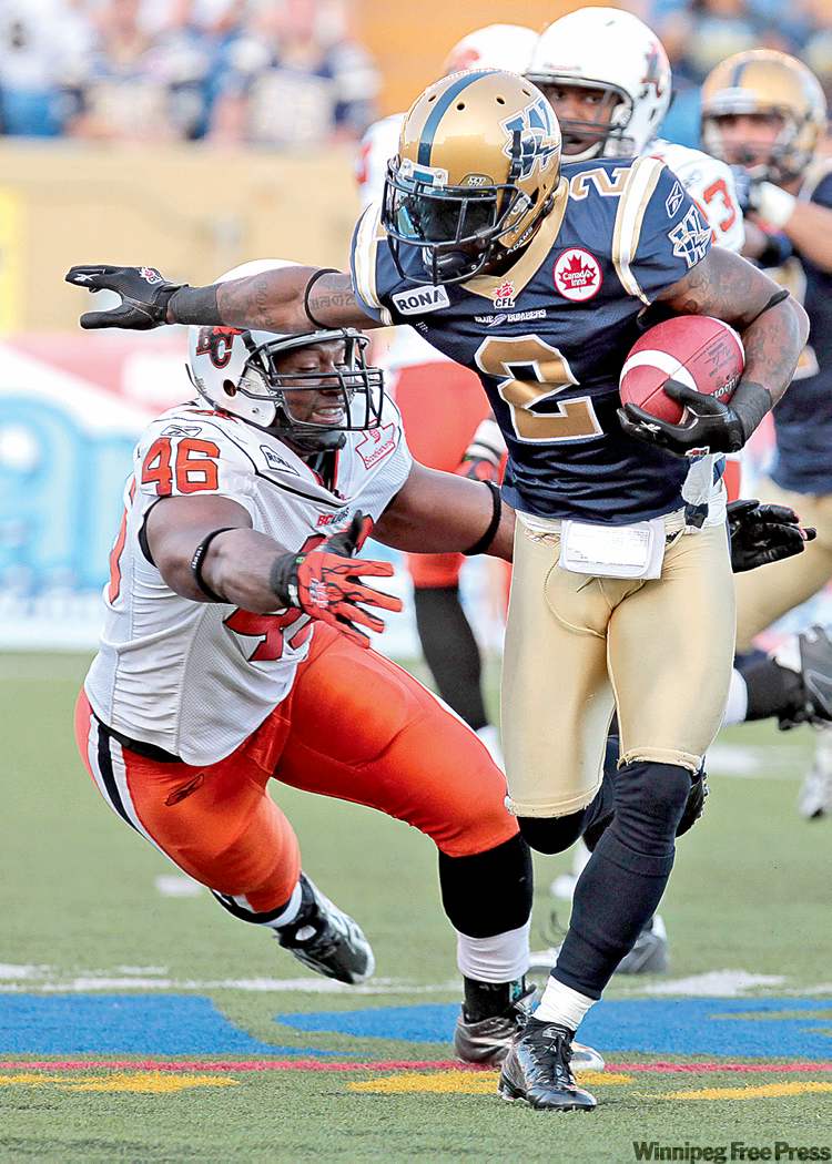 MIKE DEAL / WINNIPEG FREE PRESS
The Bombers' Jovon Johnson returns the ball while the Lions' Rolly Lumbala pursues Thursday night. The Blue were, to a man, fired up.