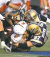 MIKE DEAL / WINNIPEG FREE PRESS
The Bomber defence ganged up on the Lions Thursday night, allowing B.C. only 297 yards of offence.