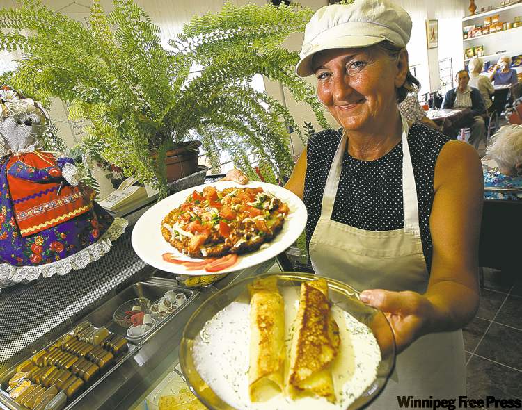 PHIL HOSSACK / WINNIPEG FREE PRESS
Jessie’s Kitchen owner Jessie Plawna offers some potato pancake pizza and nalysnyky.