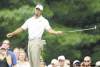 Mark Duncan / the associated press
What the...? Tiger Woods can't believe his birdie putt on the 8th hole didn't fall Friday at Firestone.