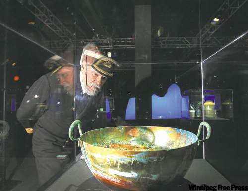 RUTH BONNEVILLE / WINNIPEG FREE PRESS ARCHIVES 
A visitor examines a display in Titanic: The Artifact Exhibition.