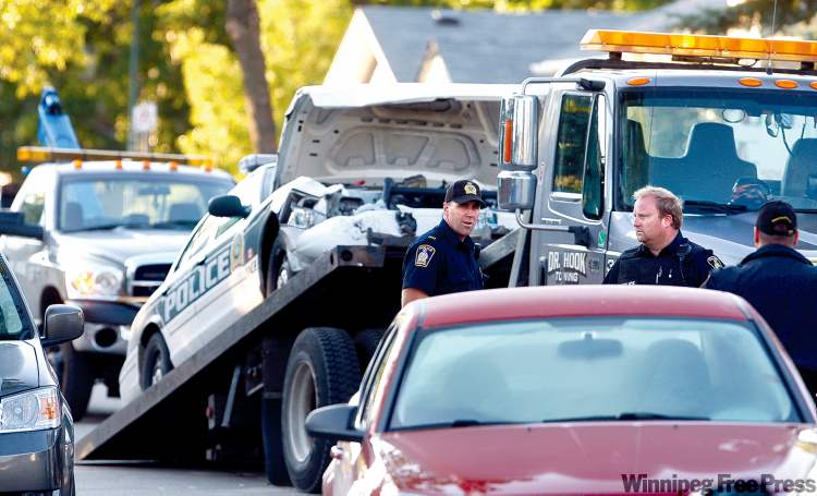 KEN GIGLIOTTI / WINNIPEG FREE PRESS
The scene near Antrim Road and Rockspur Street where three officers were injured after a collision involving two associates of the Rock Machine early Tuesday.