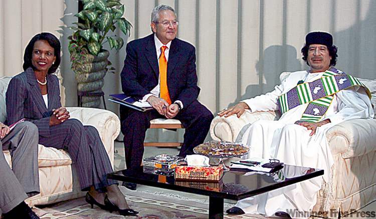 Nasser Nasser / The Associated Press archives
Condoleezza Rice (left) and Moammar Gadhafi (right) in 2008