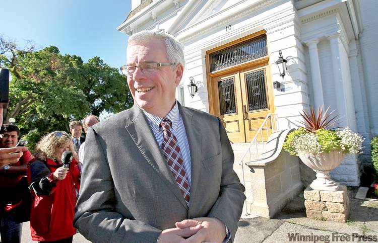 JOE BRYKSA / WINNIPEG FREE PRESS
Premier Greg Selinger emerges from Government House Tuesday after the dissolution of the Manitoba legislature and official start to the election campaign.