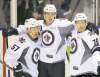 CNS Larry Wong / Edmonton Journal
Mark Scheifele (centre) celebrates his third-period goal against the Vancouver Canucks with teammates Jason Gregoire (left) and Shayne Wiebe at the 2011 Young Stars tournament in Penticton, B.C., on Thursday. Scheifele, the Jets' first-round draft pick, is making a very good impression with his performance.