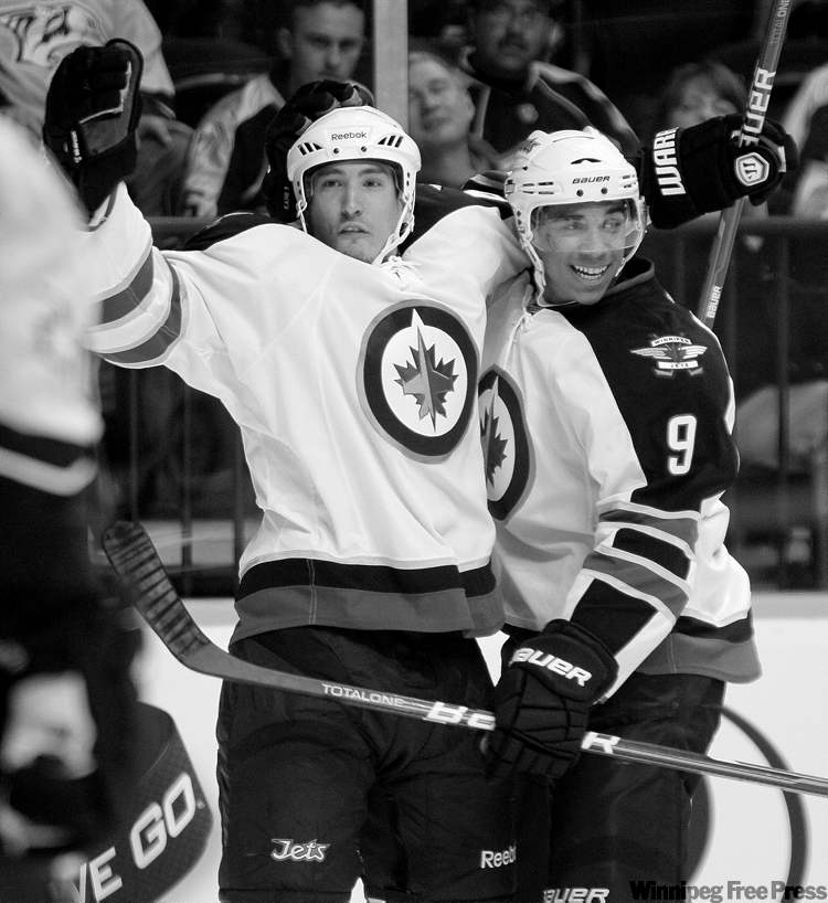 Mark Humphrey / the associated press
Jets right-winger Spencer Machacek celebrates with Evander Kane (9) after scoring against the Nashville Predators on Saturday.