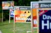 TREVOR HAGAN / WINNIPEG FREE PRESS 
Signs show a heated battle is on in Elmwood. Whichever party you support, just be sure to get out and vote.
