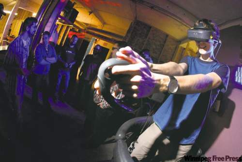 John Woods / Winnipeg Free Press
Justin Lacko tries on some virtual reality.