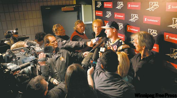 Ruth Bonneville / Winnipeg Free Press
Bombers starting QB Alex Brink tries to fend off media hordes Thursday afternoon.