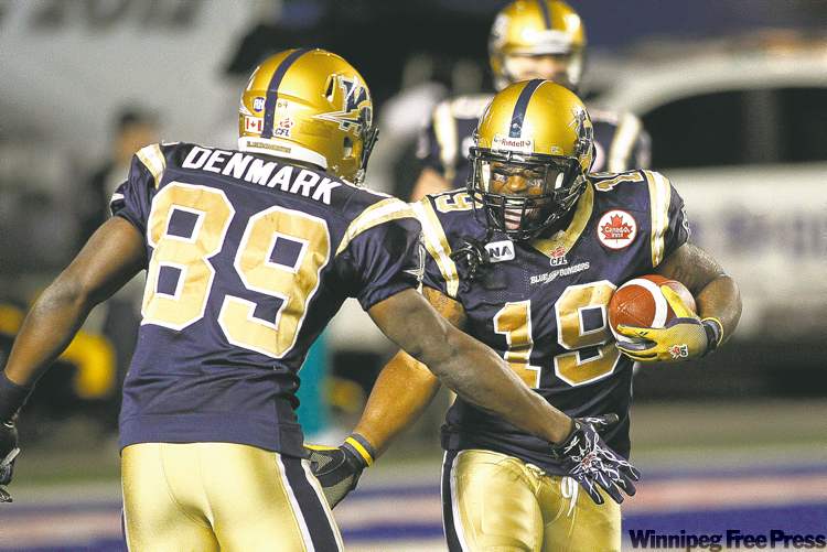 JOHN WOODS
john woods / winnipeg free press
Replacement running back Chris Garrett (19) ripped off some good runs, scored a TD and was perfect on his assignments.