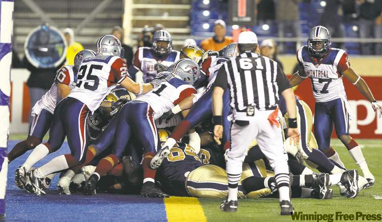 CP
jason halstead / the canadian press
Alex Brink just couldn�t penetrate the Als� defence with two tries from the one-yard line. He should have had a third, Bombers coach Paul LaPolice believes.