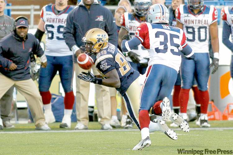 john woods / winnipeg free press
Bombers' Clarence Denmark catches a pass against Montreal Alouettes' De'Audra Dix in first half Friday. The Bombers are still a threat, if they can dust themselves off and get back to basics.
