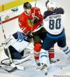 JOE BRYKSA / WINNIPEG FREE PRESS
Chicago's Jonathan Toews gets slammed into Winnipeg Jets goaltender Ondrej Pavelec by Nik Antropov during first-period action Thursday night.
