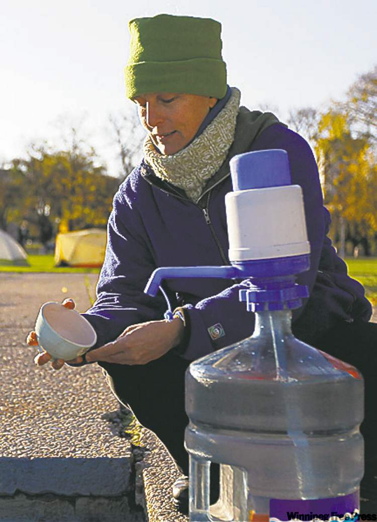 Photos by Trevor Hagan/ Winnipeg Free Press
D-Anne Kuby gets a drink of water in Memorial Park.